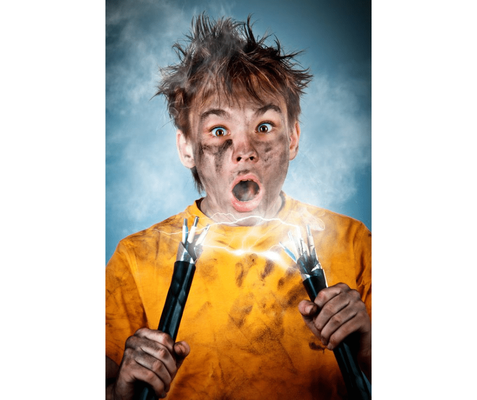 Person receiving an electric shock from a damaged wall outlet.