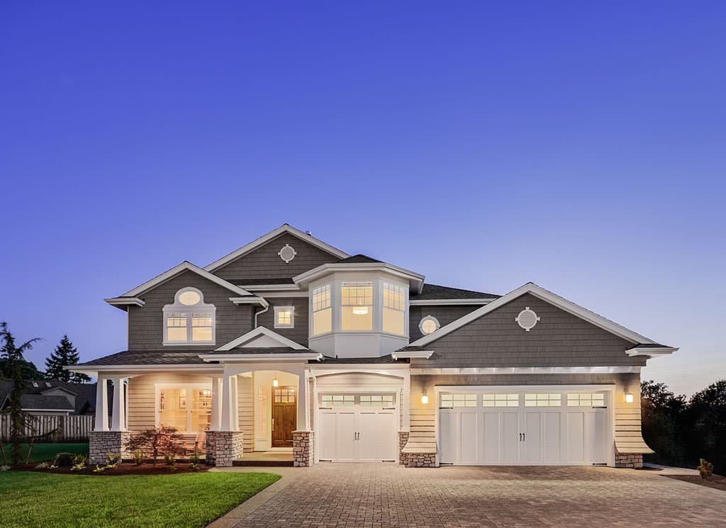 outdoor front view of Newton home lit up at dusk